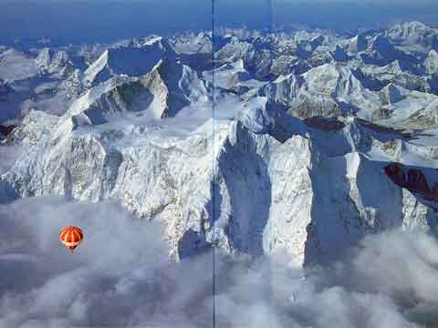 
Chomolonzo rises from the mists below the Makalu North Face. Chamlang is directly above Makalu; Baruntse is to the right of the Makalu La - Ballooning Over Everest book
